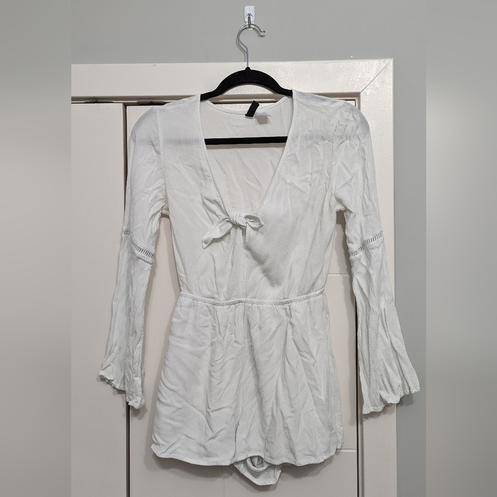 White romper with tie detail in the middle. Italian summer vibes